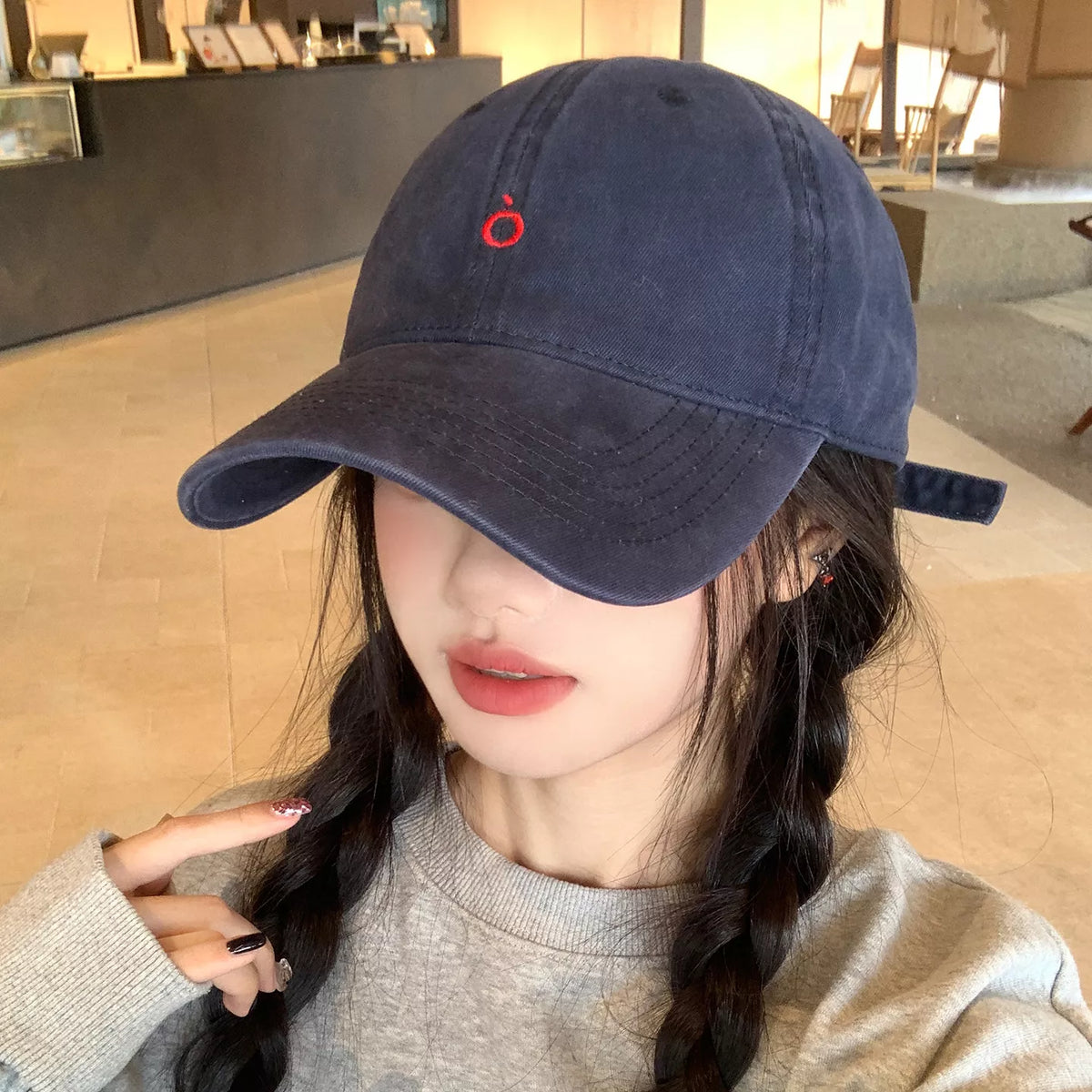 Embroidered cotton baseball cap in black, front view