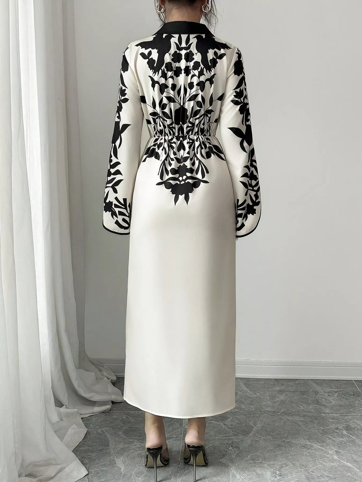 White and black wrap midi dress close up of fabric