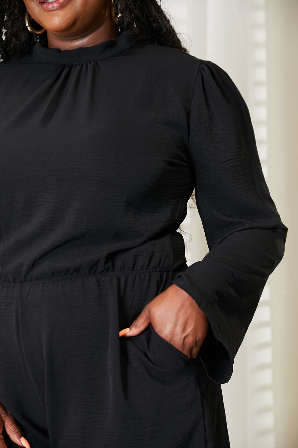 Close up of the open back on the black romper