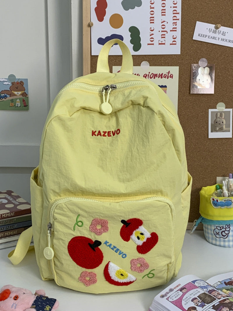 Yellow embroidered nylon mini backpack front view