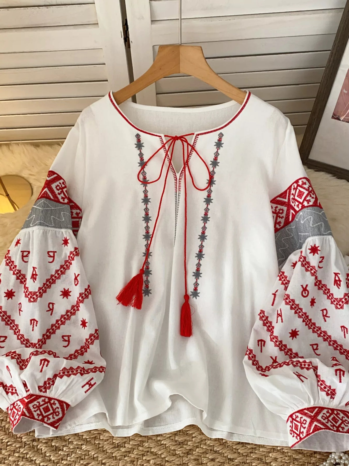 Embroidered tie neck blouse fabric detail