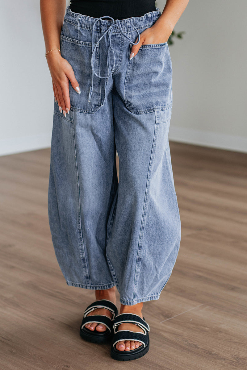 Blue paperbag waist barrel jeans front view with patch pocket and drawstring