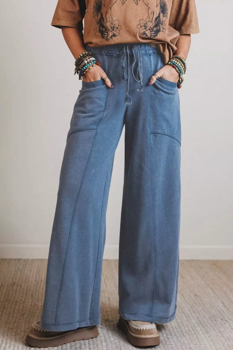 Relaxed fit drawstring jeans front view in medium blue