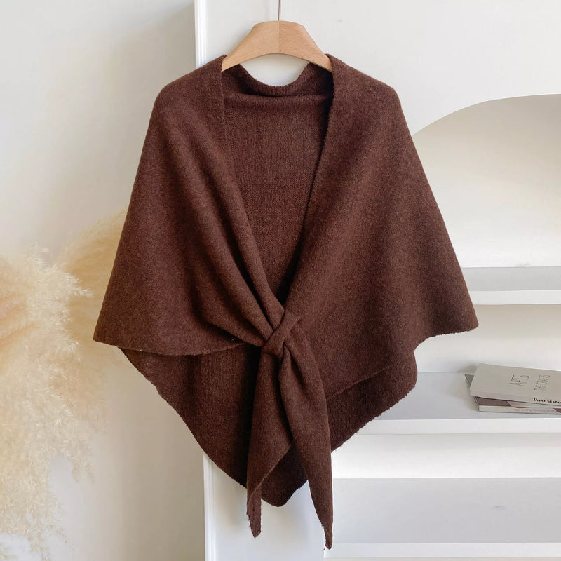 Knitted solid color scarf shawl draped over the shoulders