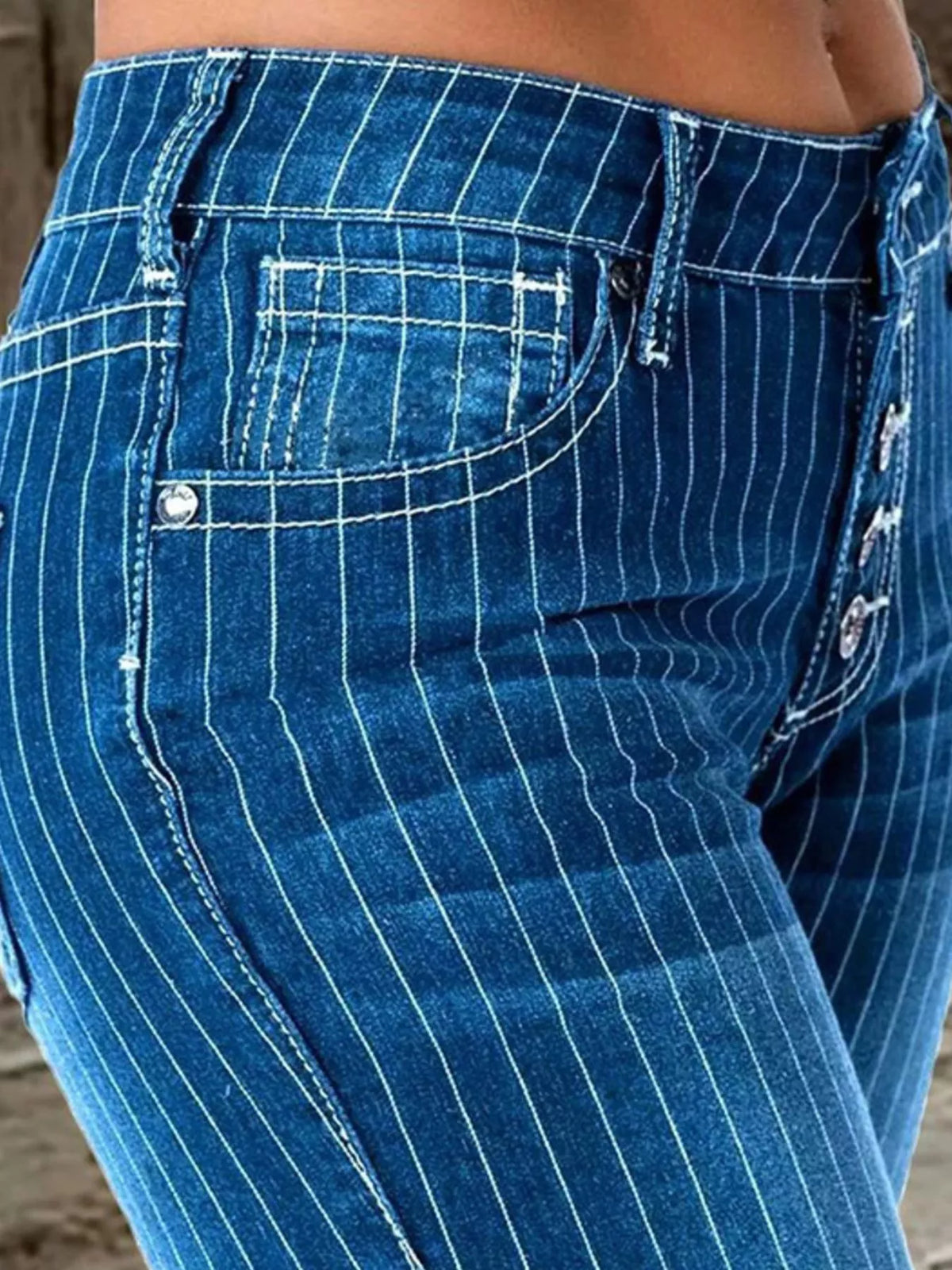 Side view of flared striped jeans