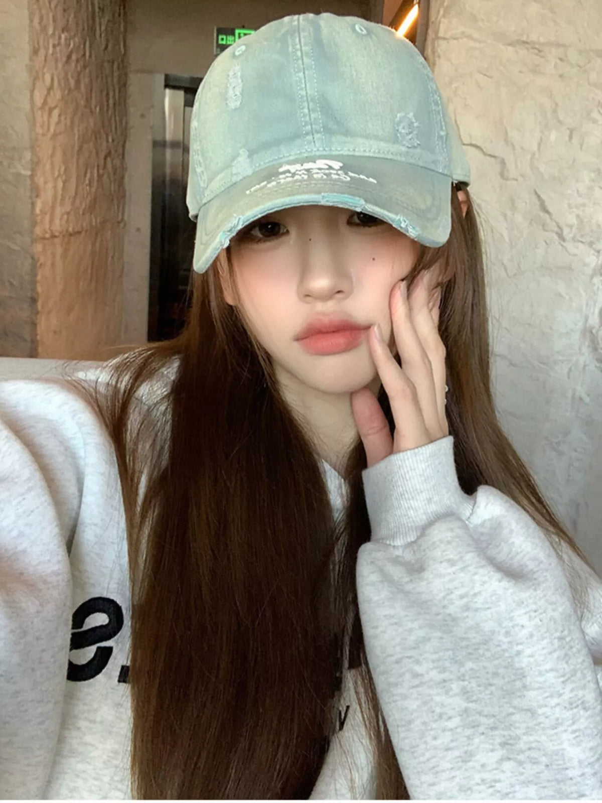 Low crown cotton cap shown at a side angle