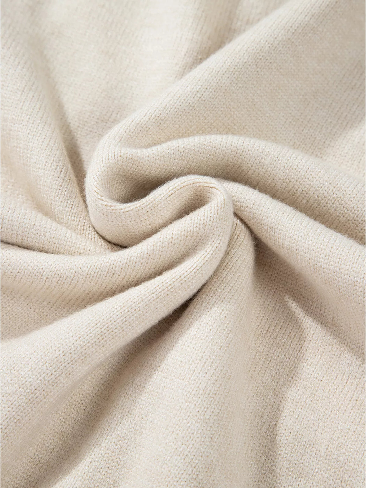 Side profile of the longer body mock neck sweater