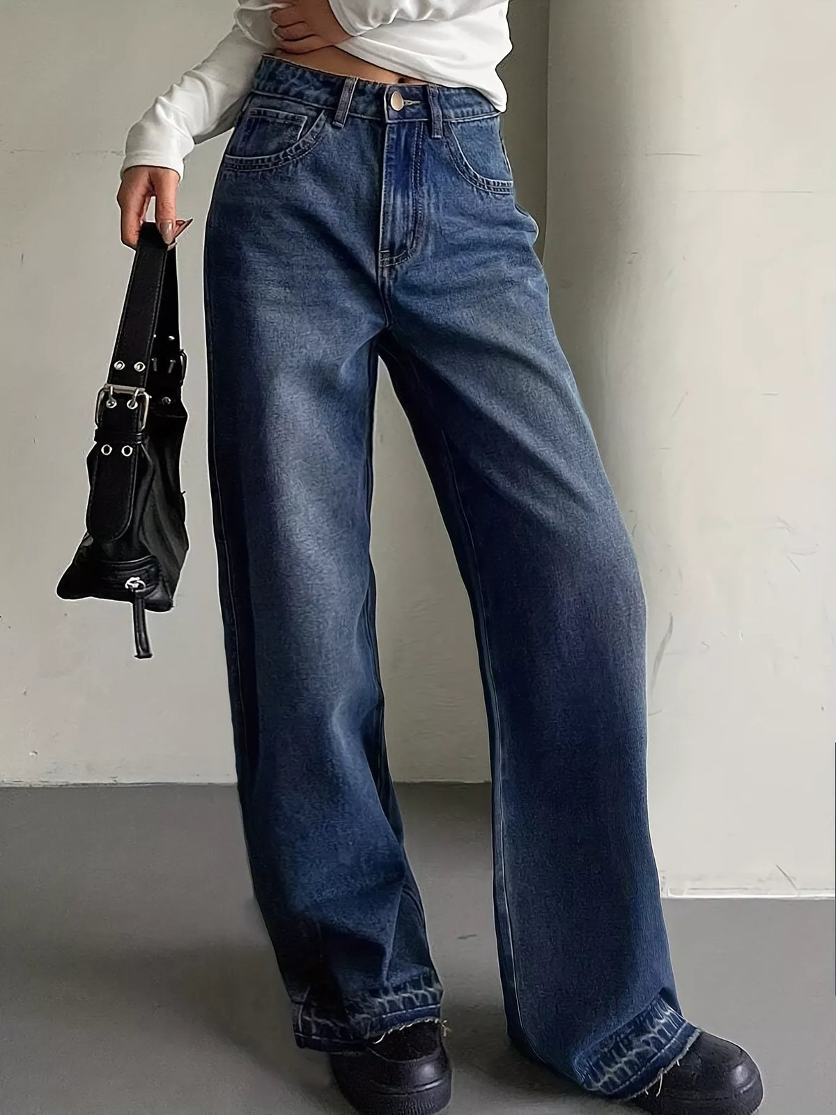Faded wide leg jeans showing broken in denim