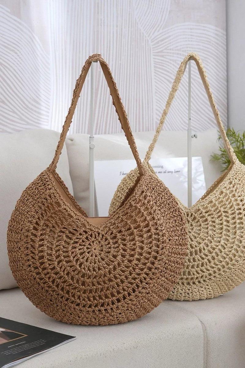 Round woven straw shoulder bag front view