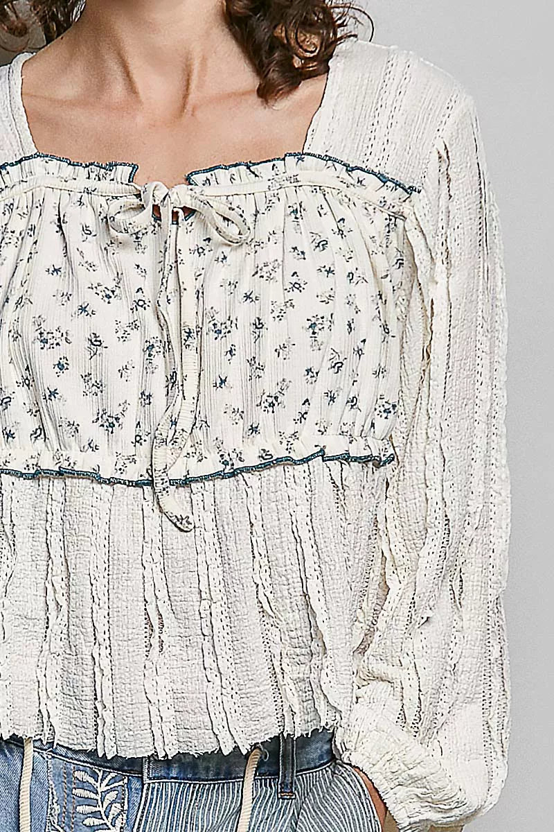 Cream lace balloon sleeve top styled with denim
