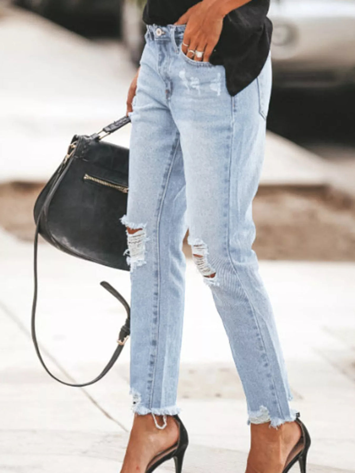 Ankle jeans showing distressed detailing