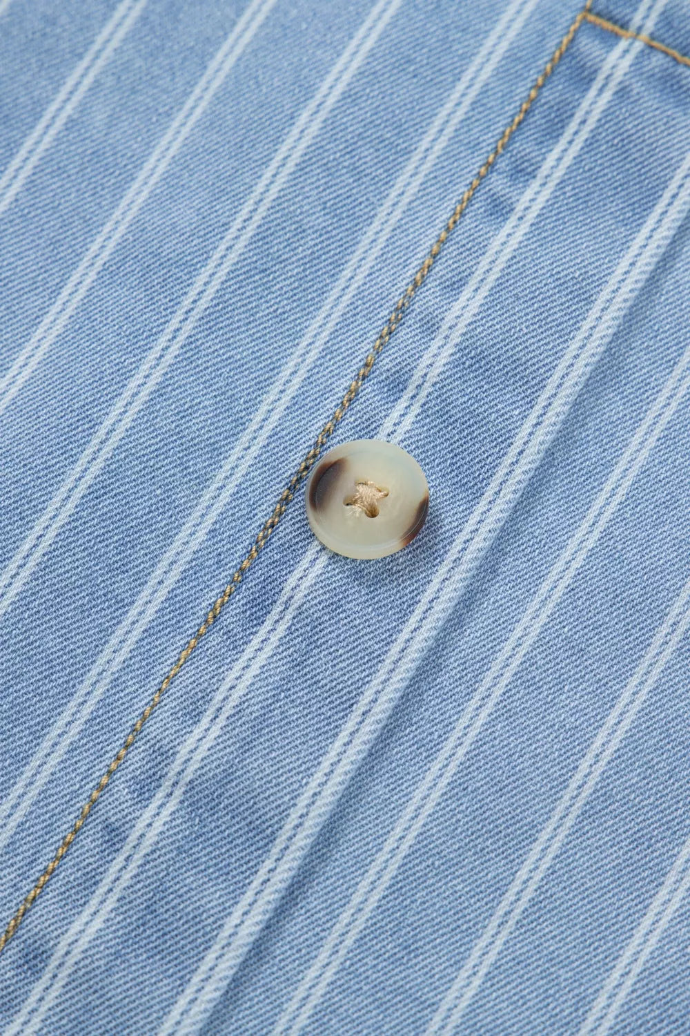 Light blue striped button back denim mini dress, back view