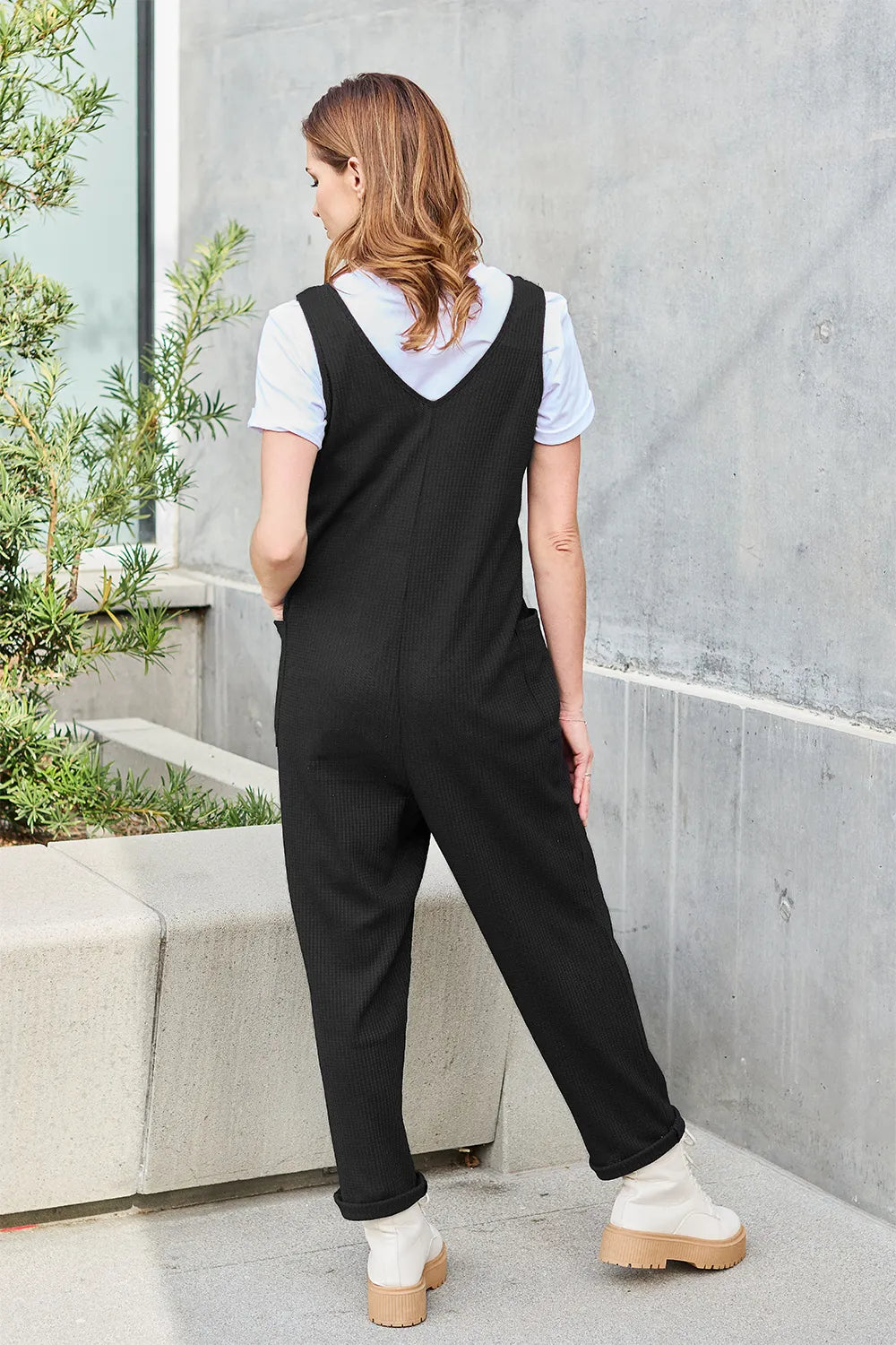Straight leg jumpsuit side profile view