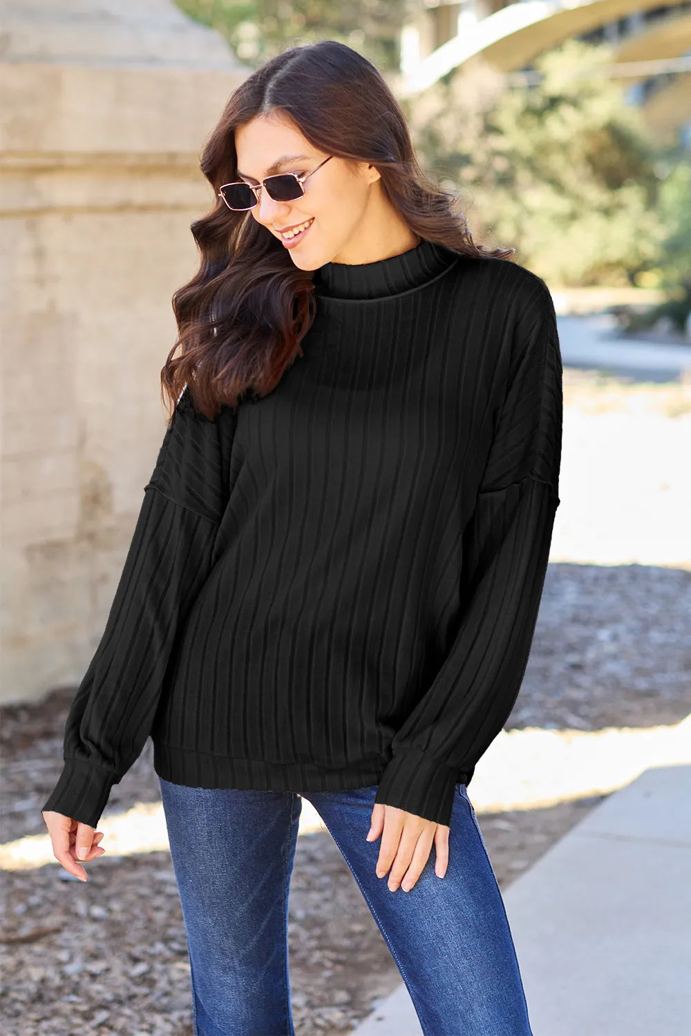 Exposed seam mock neck top in a deep colorway