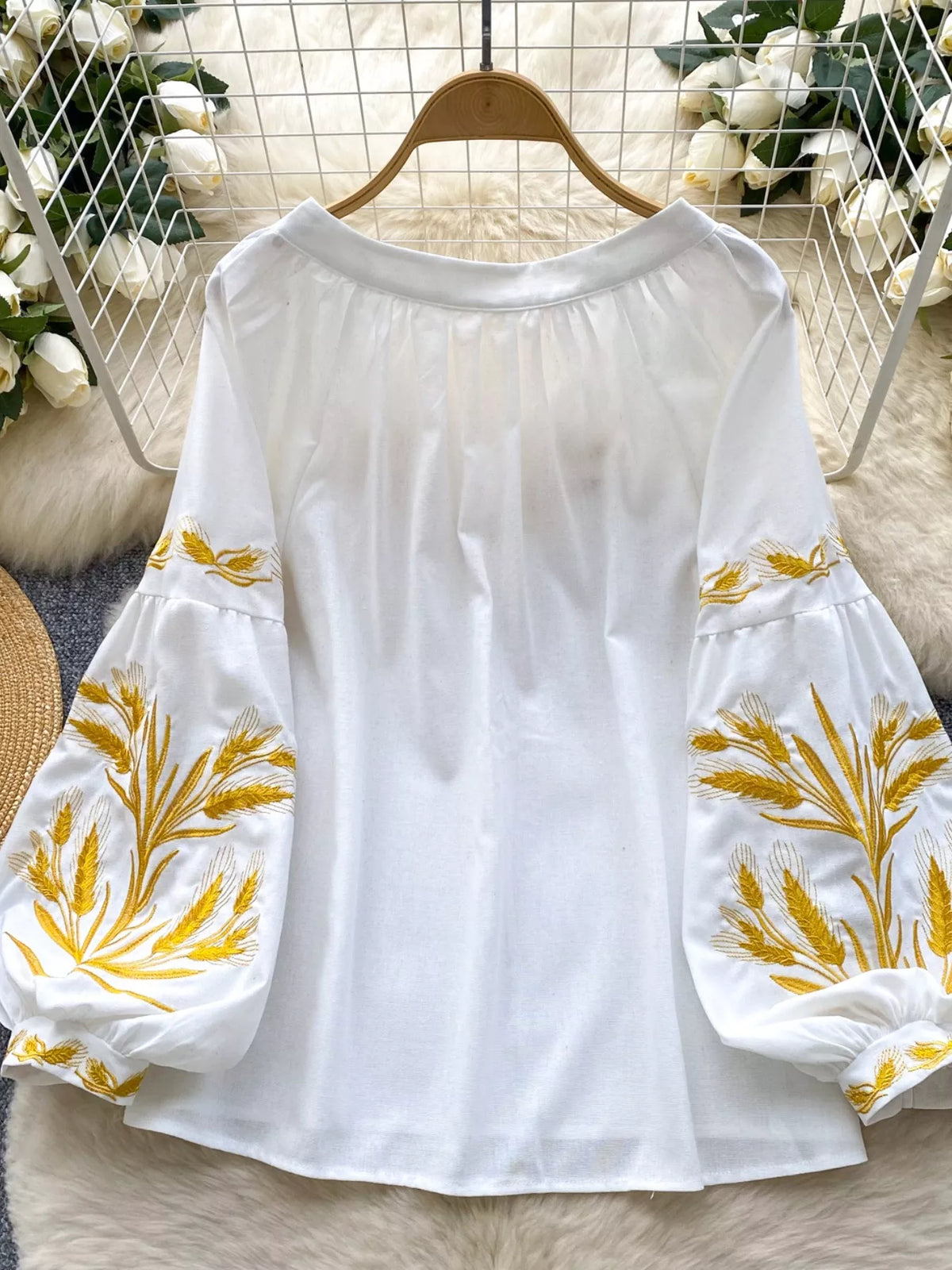 embroidered wheat pattern tie neck blouse back detail