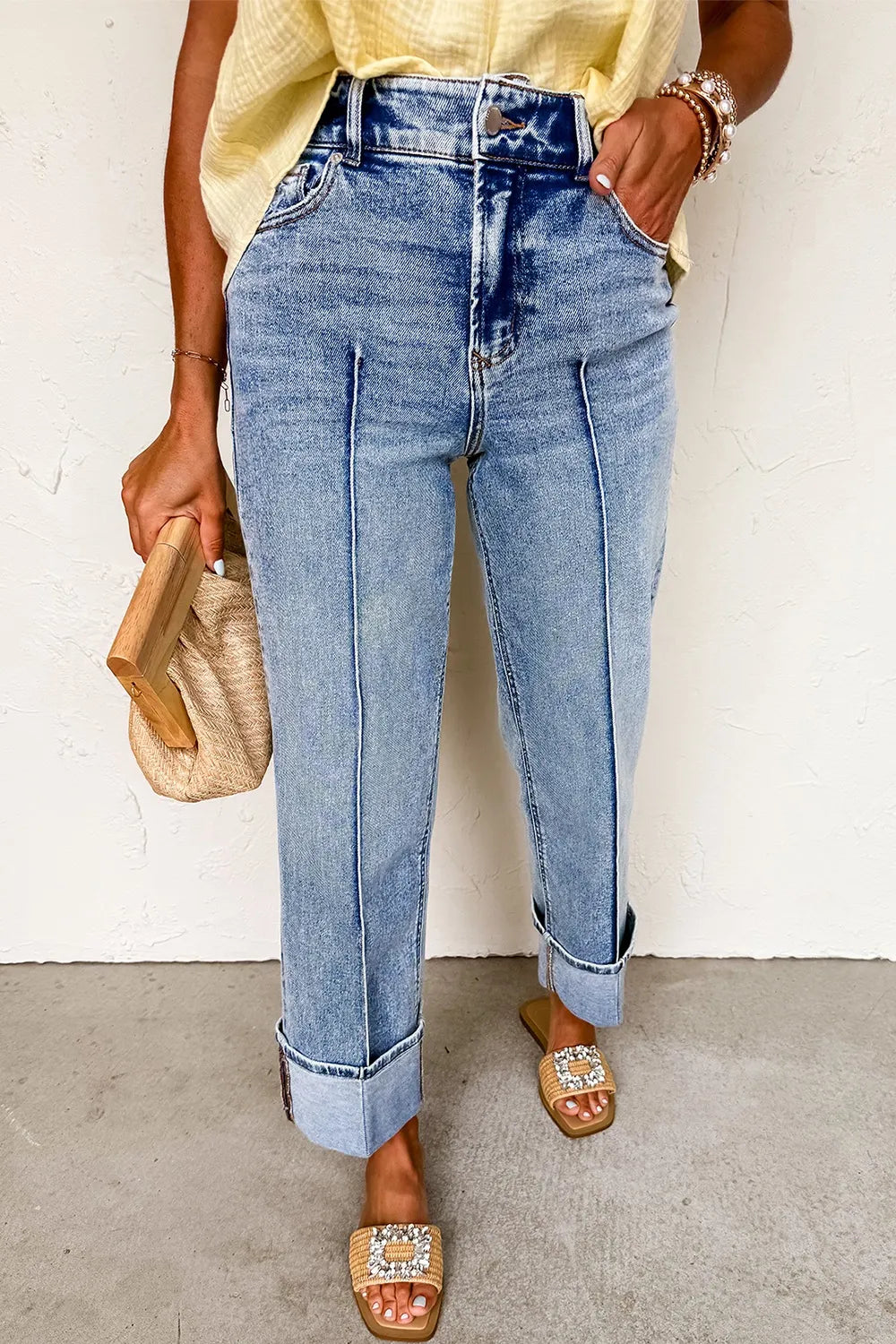 Medium wash cuffed wide leg jeans side profile