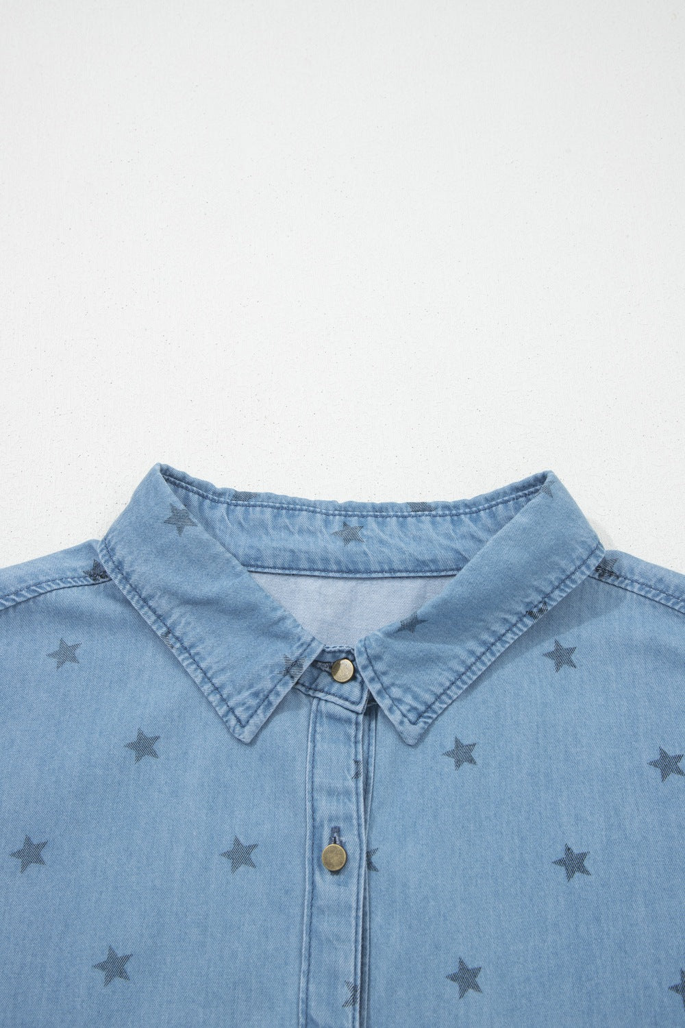 Short sleeve denim shirt three quarter view