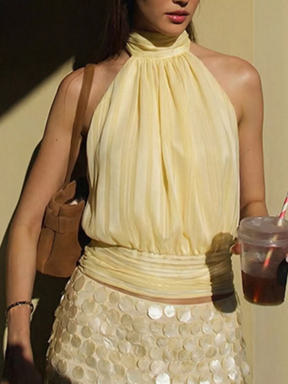 Striped cami styled with high waisted trousers