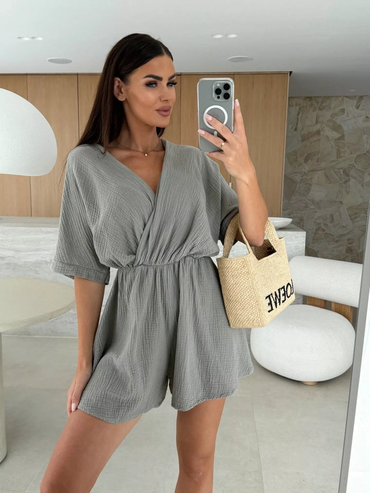 Surplice wrap front short sleeve romper styled view