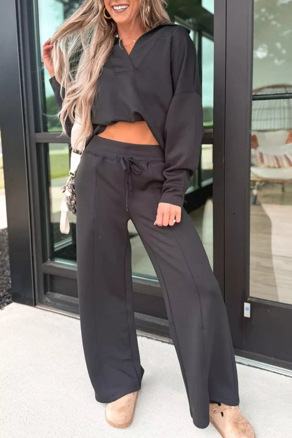 Black collared V neck sweatshirt and sweatpants two piece set front view