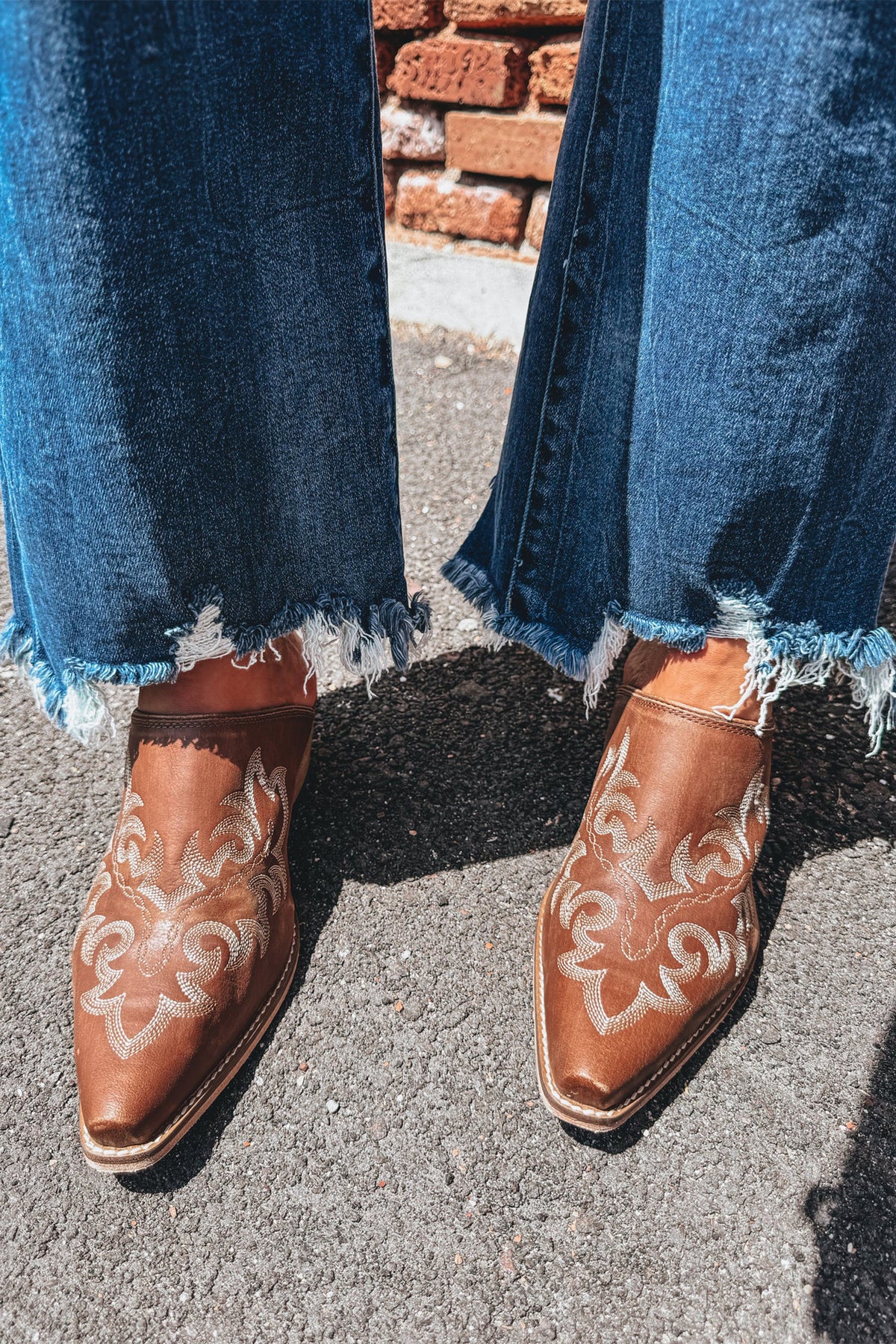 Blue stretch denim high waist flare jeans close up