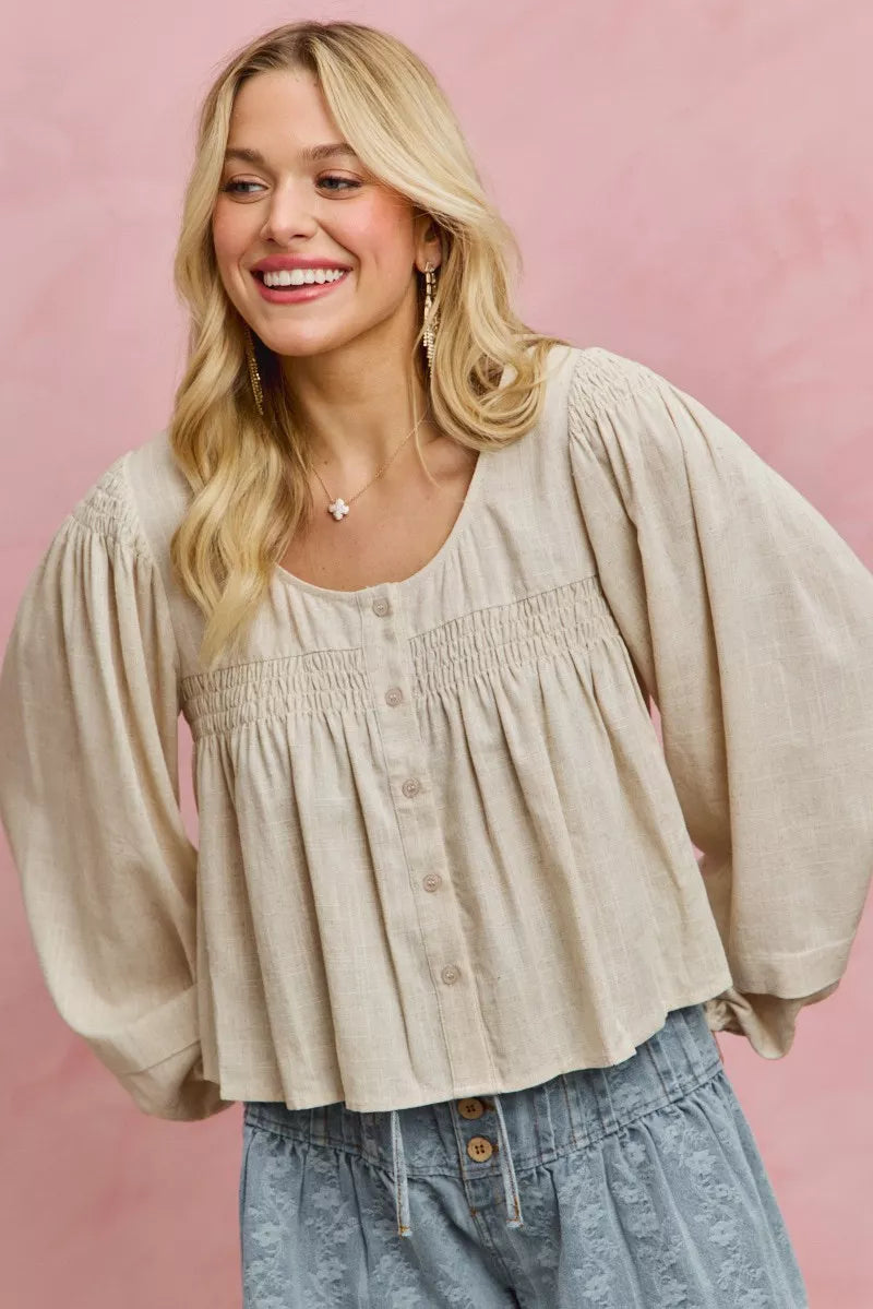 Cream linen blend smocked long sleeve top, fabric detail