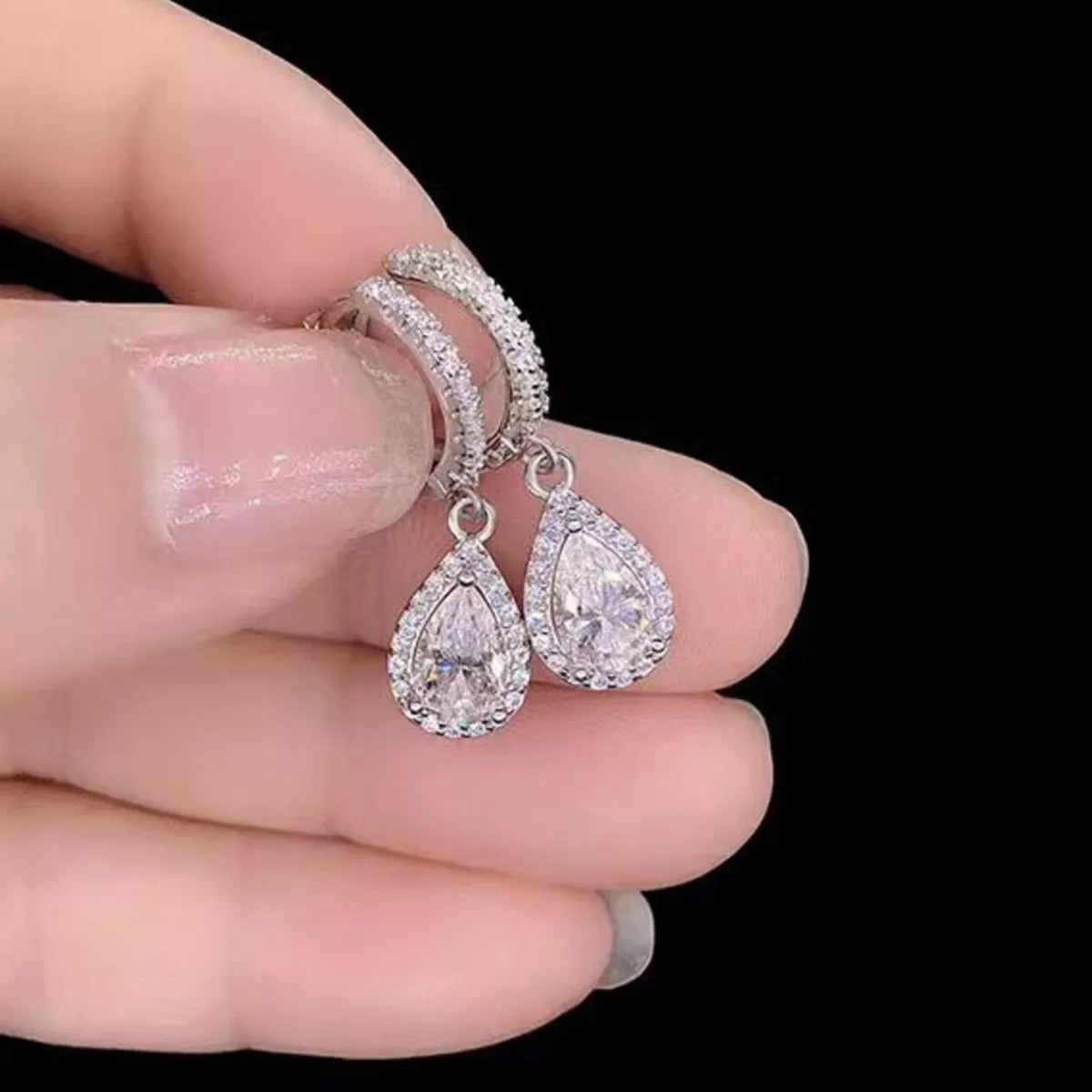 Angled view of the sterling silver hoop earrings