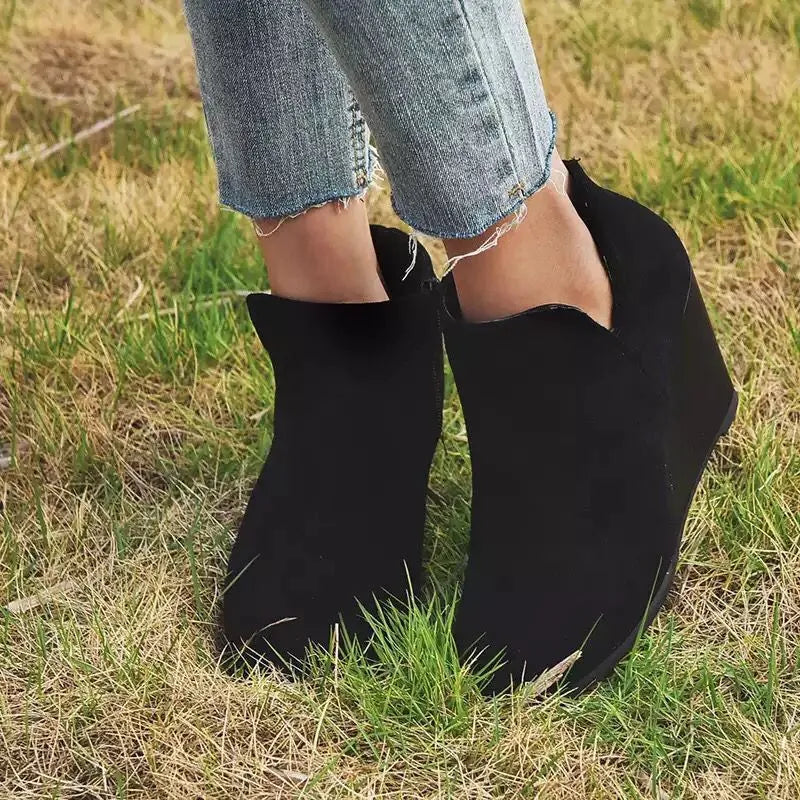Black high heel ankle boots with side zip heel detail