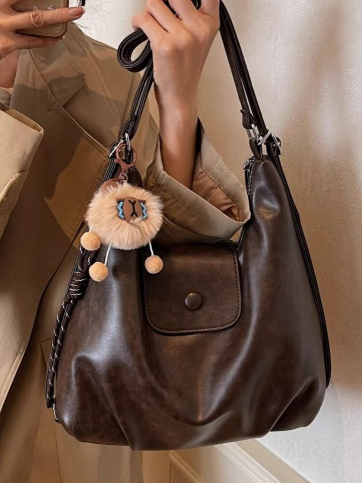 Black faux leather adjustable strap bag