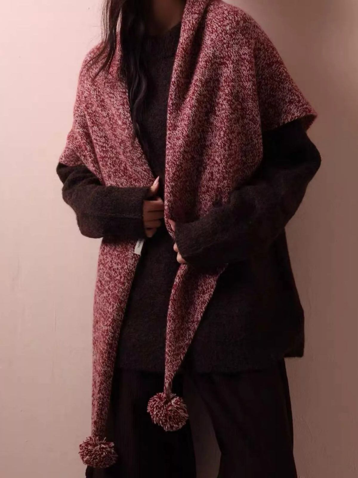 Full length view of the wool pom pom knitted scarf