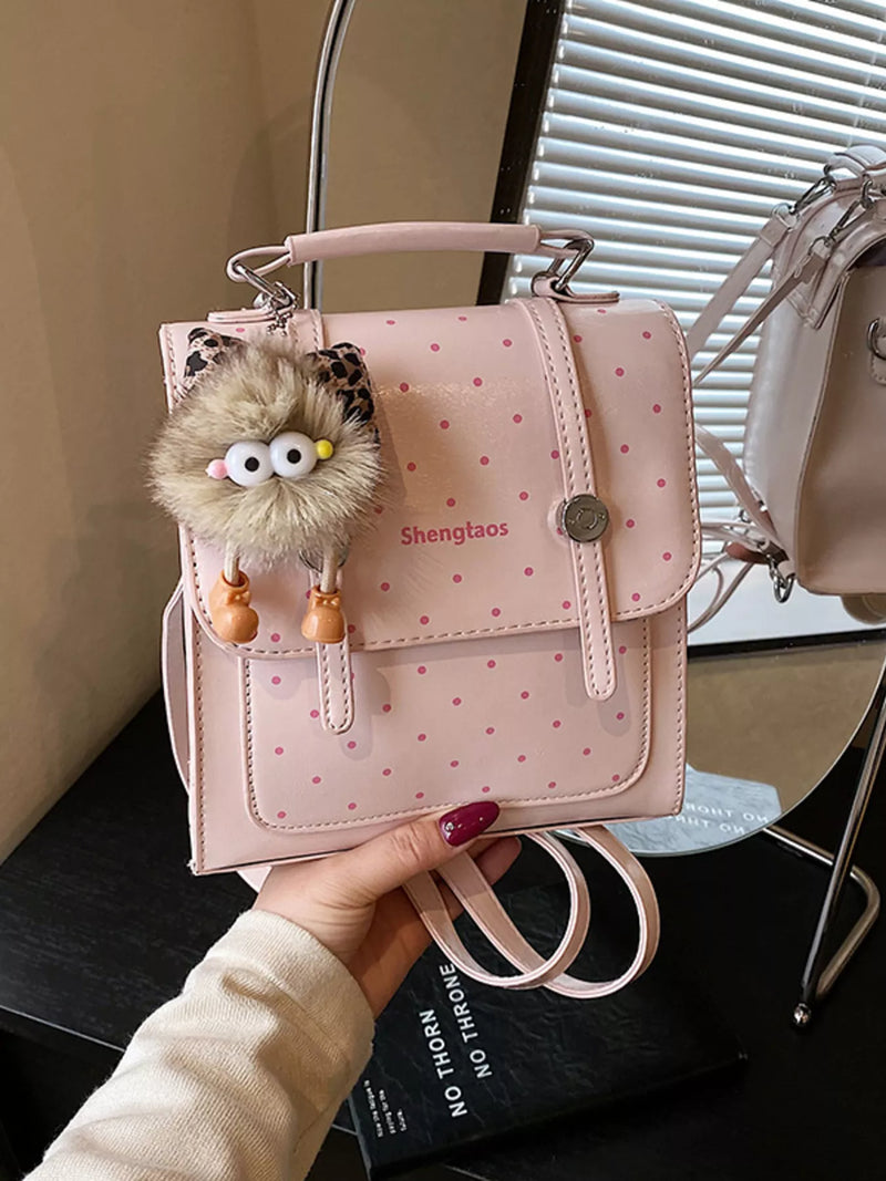 Blush pink polka dot mini backpack front view