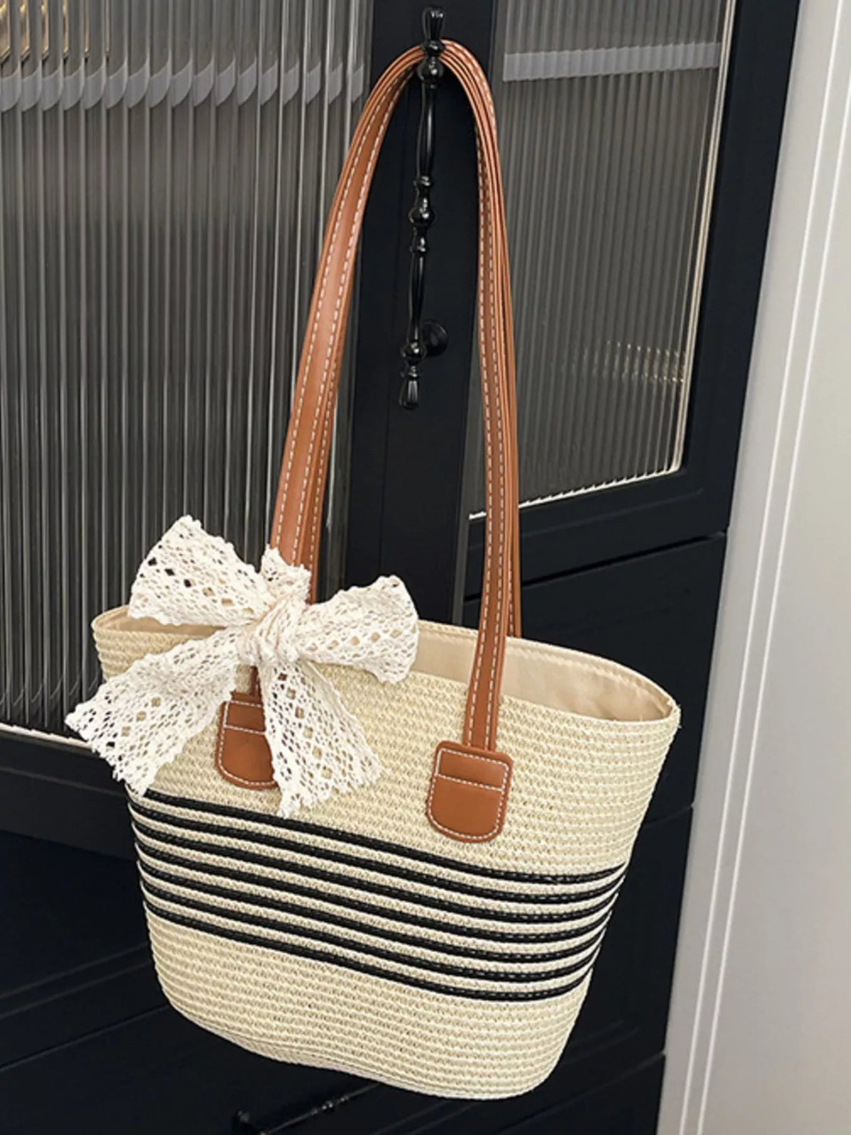 Black woven straw shoulder bag