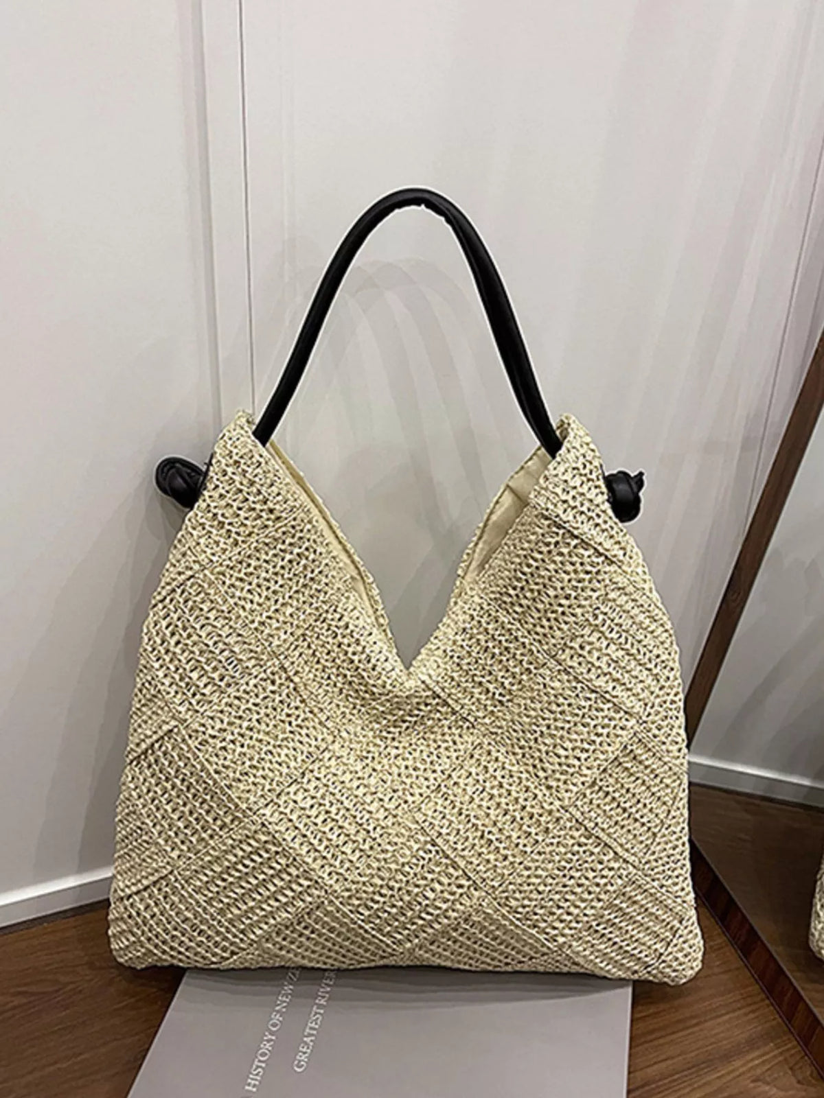 Off white woven straw shoulder bag front view