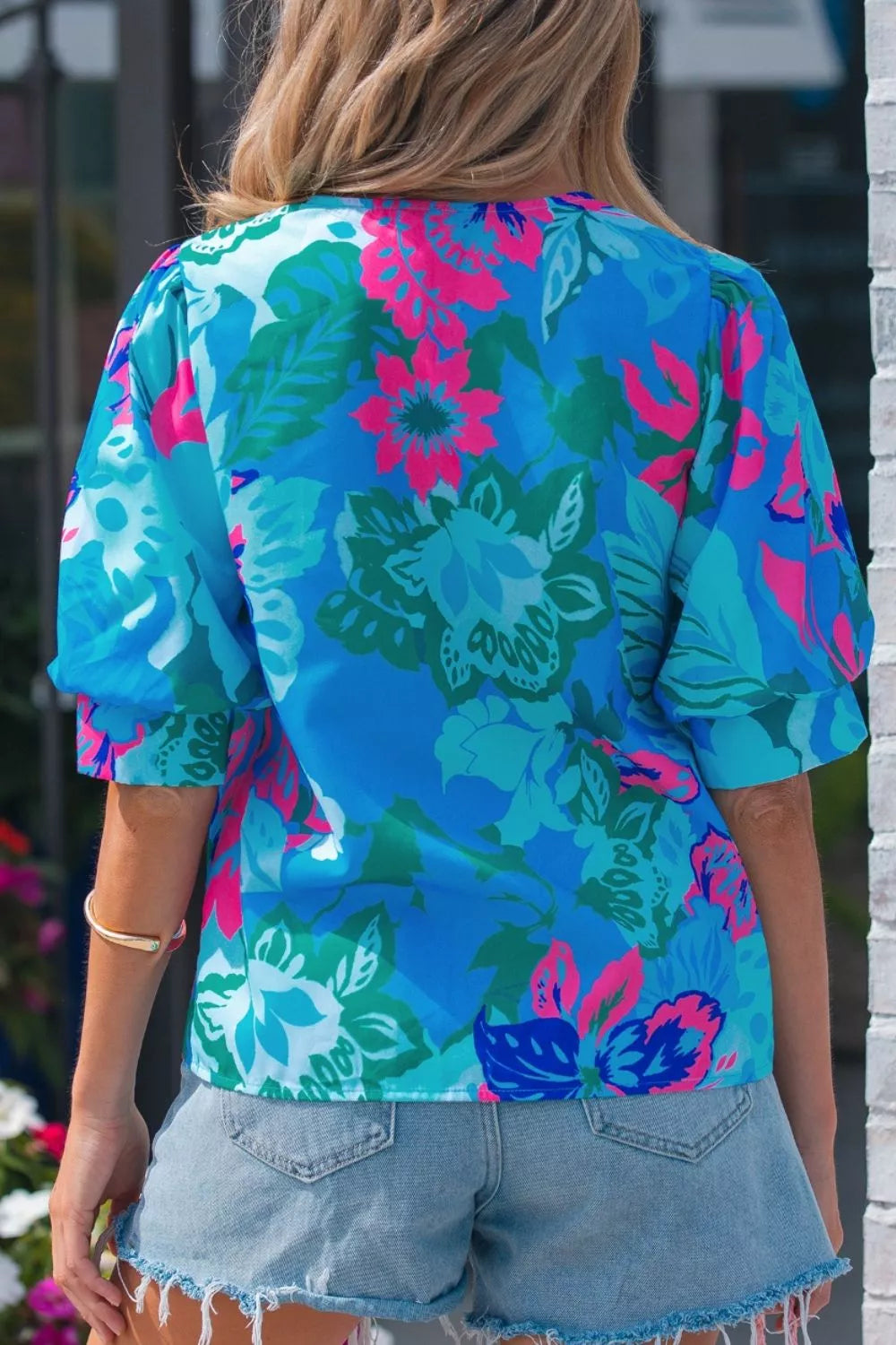 Pastel blue floral blouse neckline detail