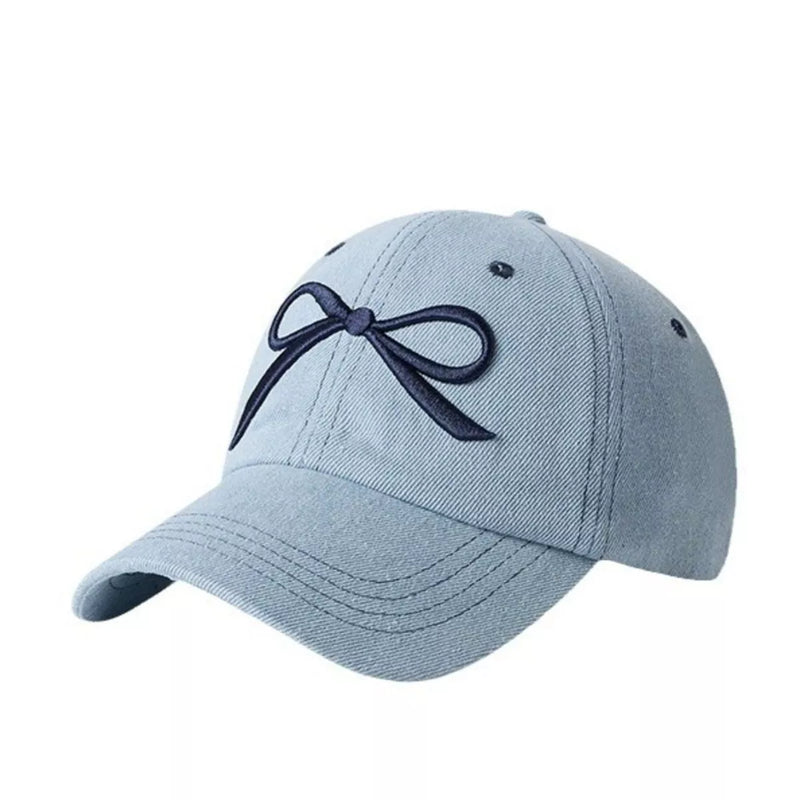 Light blue baseball cap with an embroidered bow shown from the front