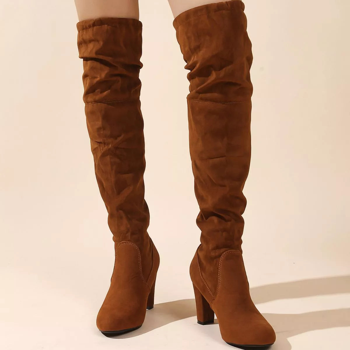 Over the knee high heel suede boots angled view
