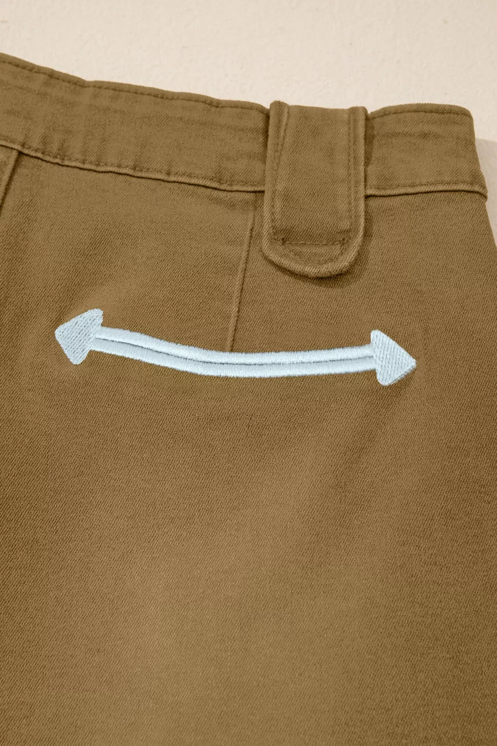 Denim texture close up on coffee brown shorts