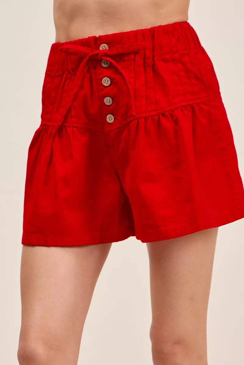 Red twill denim pintucked shorts front view