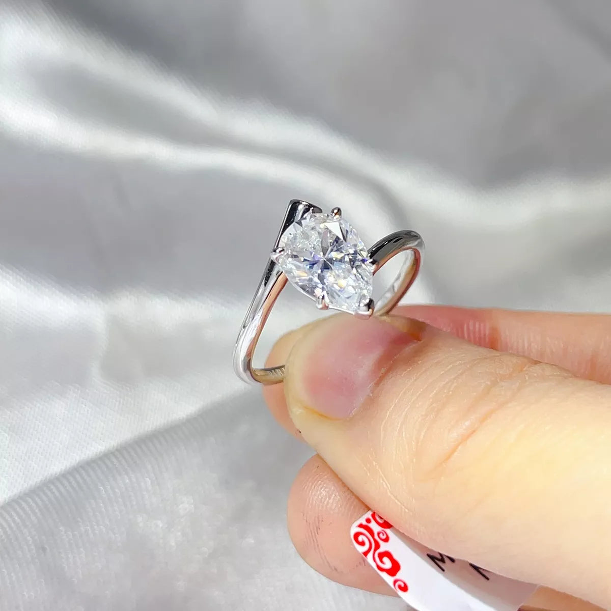 Close up of the clear moissanite stone and setting