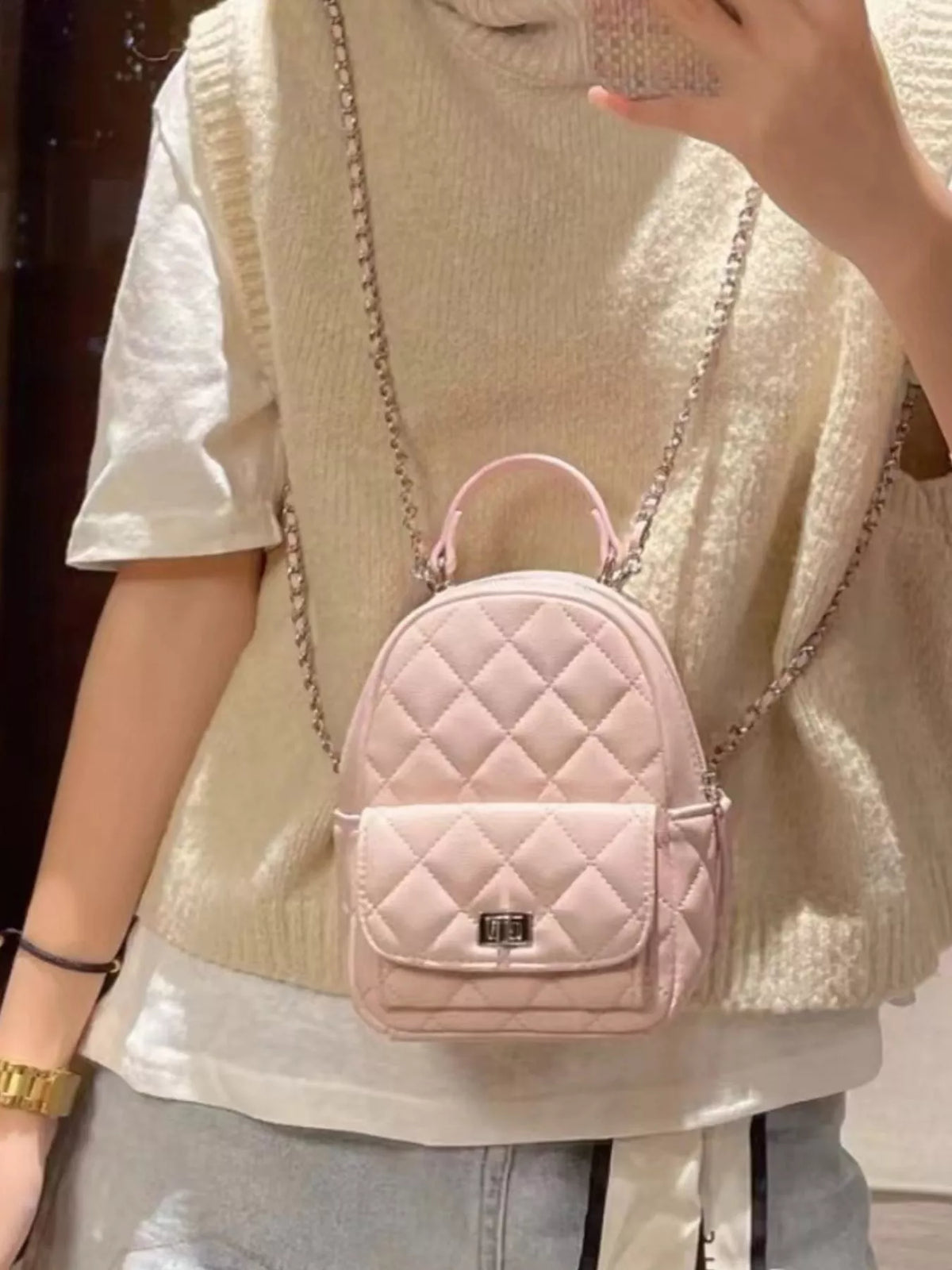 Quilted mini backpack shoulder strap detail