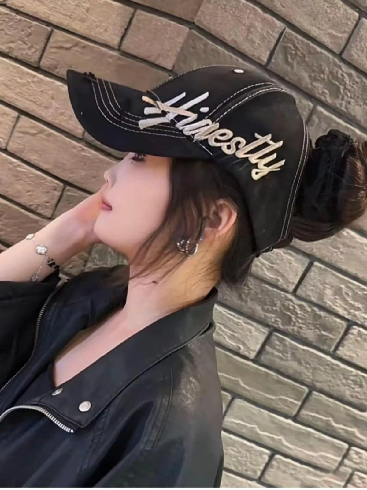 Embroidered baseball cap shown as a summer accessory
