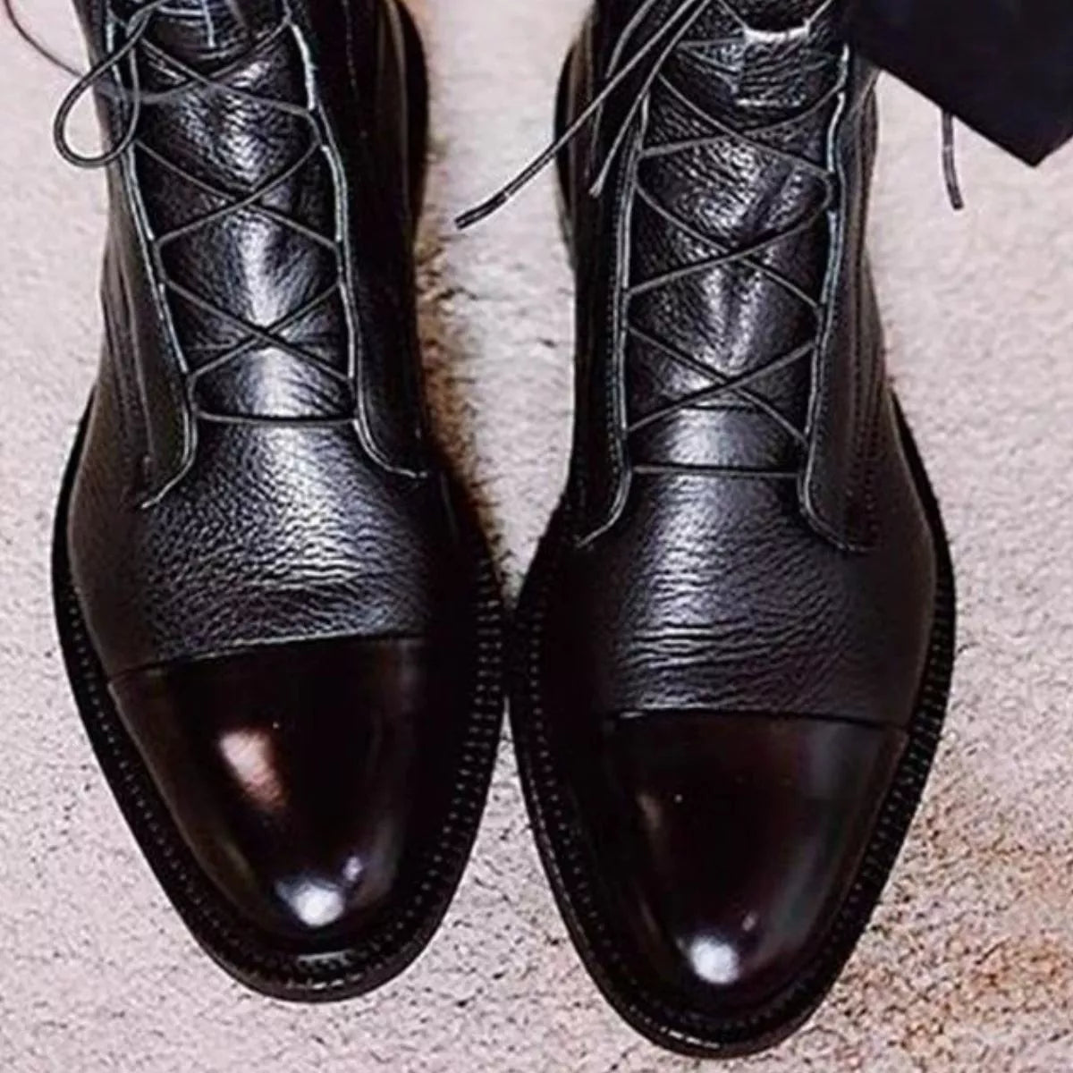 Brown lace up leather boots angled three quarter view