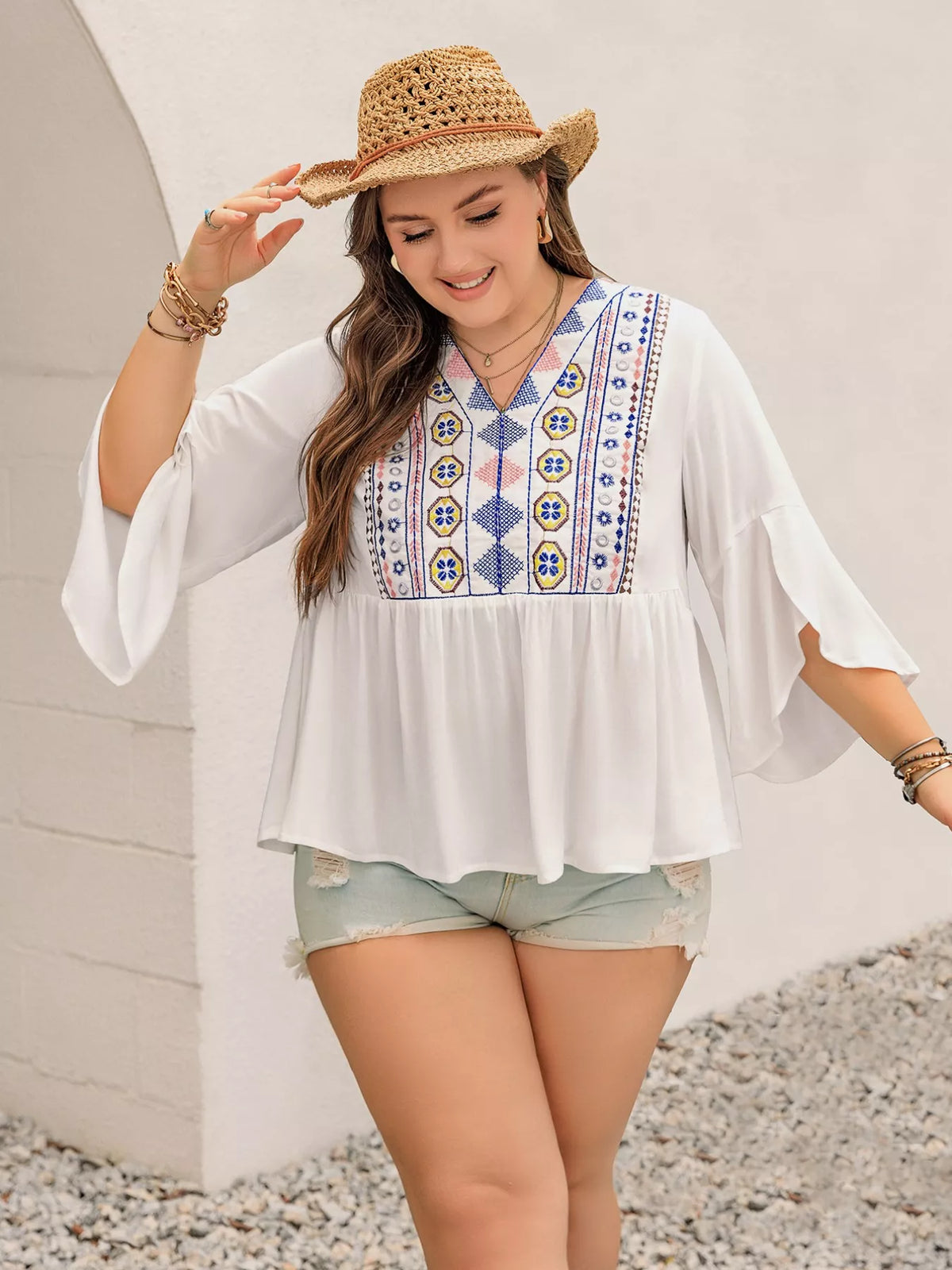 V neck blouse with flowing flare sleeves side view