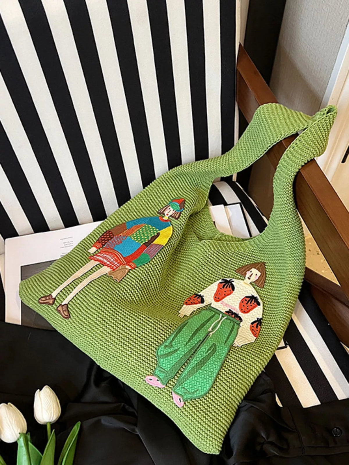 Side view of green knitted shoulder bag