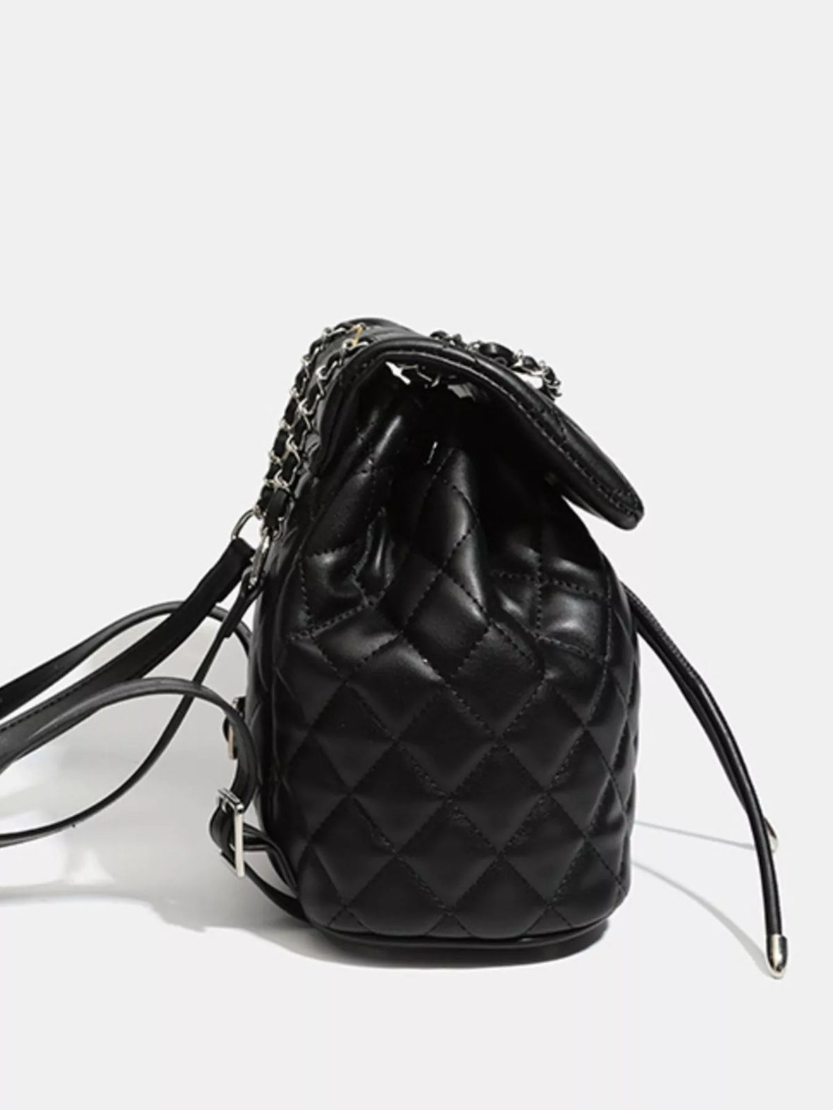 Black quilted chain flap backpack top handle close up