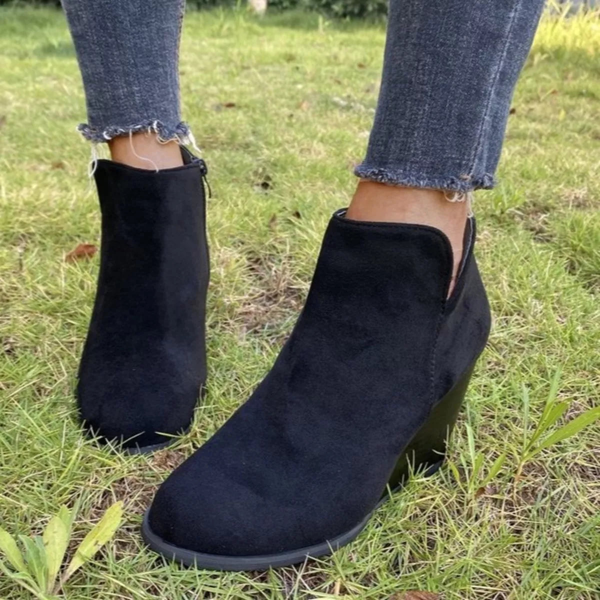 Round toe wedge ankle boots side profile