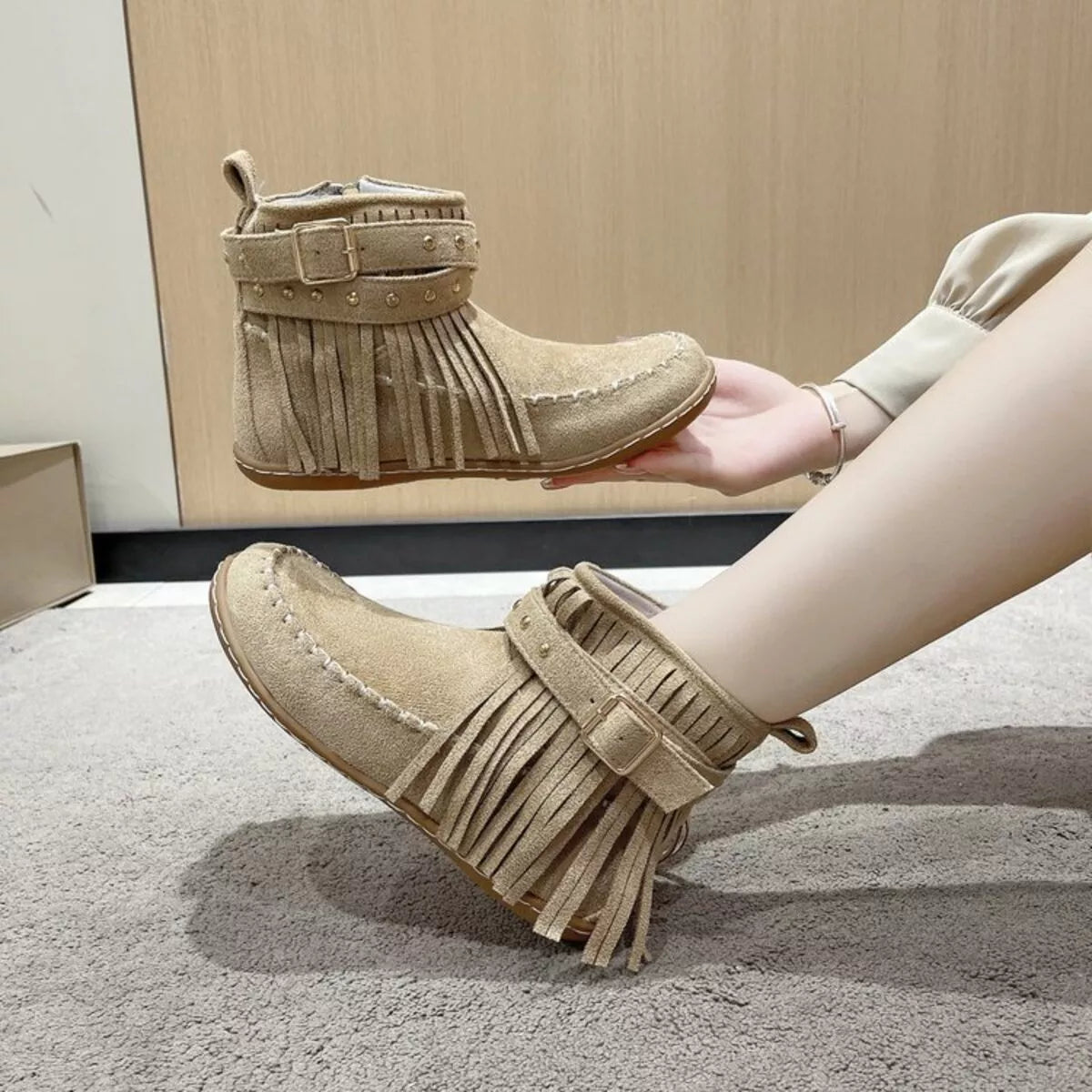 fringe round toe boots paired with a dress