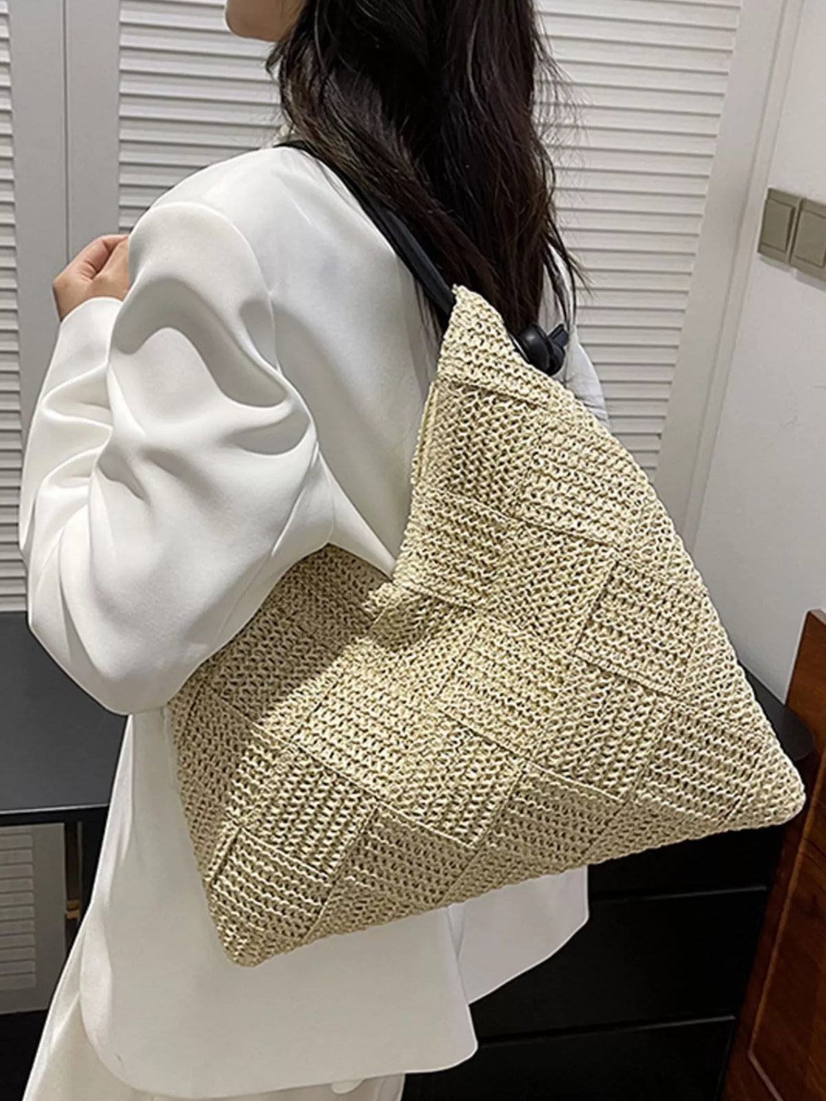 Woven straw beach purse styled with summer outfit