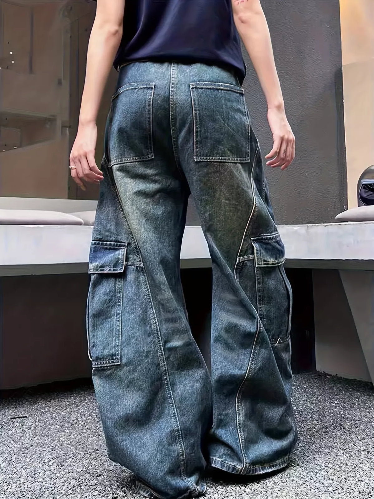 Model wearing vintage wash wide leg cargo jeans