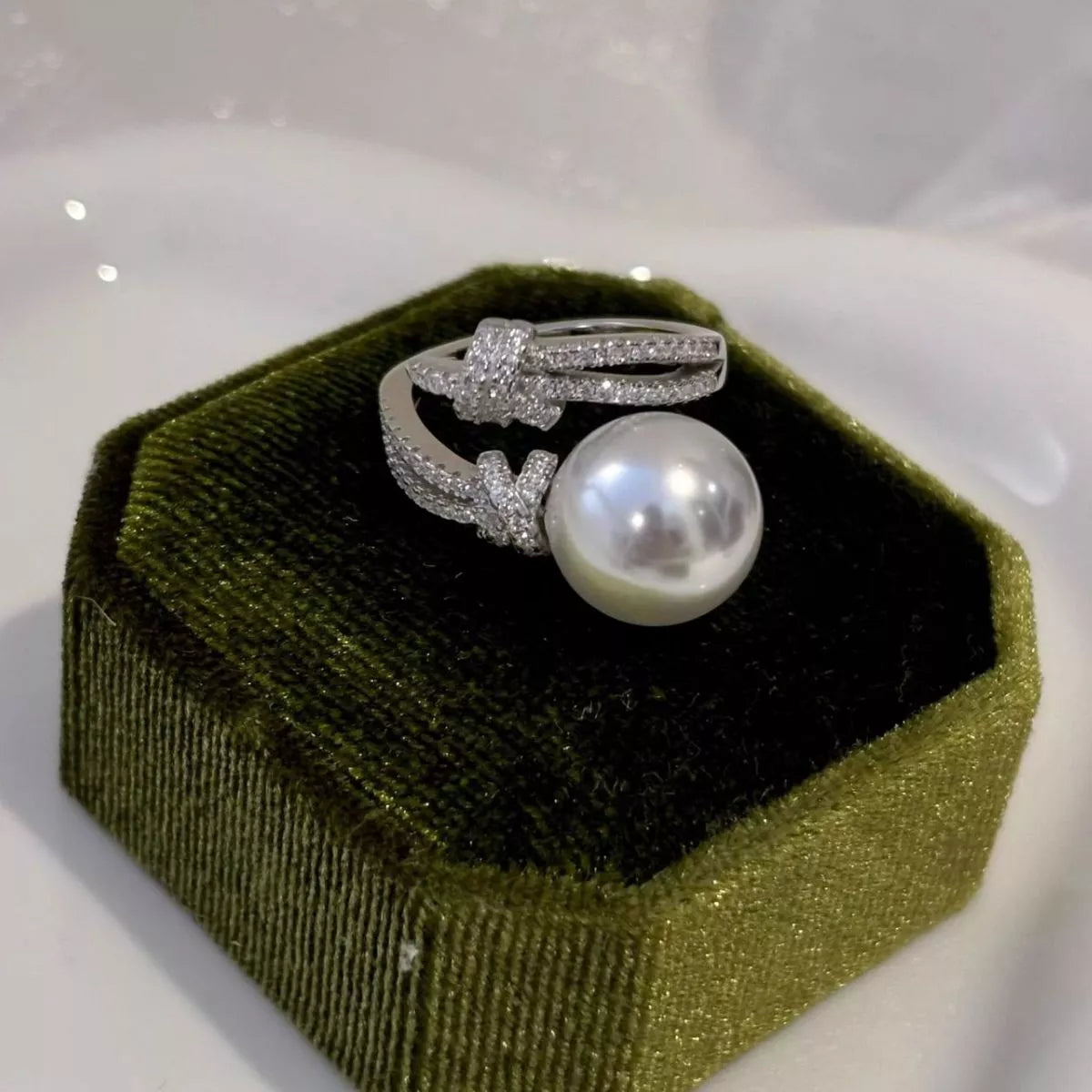 pearl and zircon bypass ring in sterling silver on model